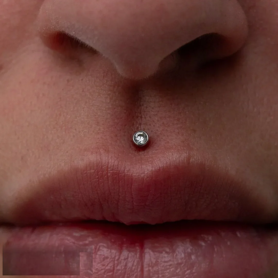 Crystal medusa philtrum stud in implant grade titanium, lip piercing at Rebel Tattoos Gurgaon