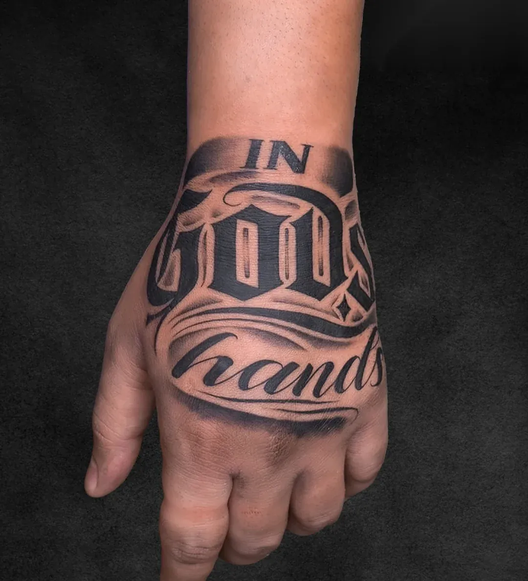 In God's Hands hand lettering script tattoo at Rebel Tattoos Gurgaon
