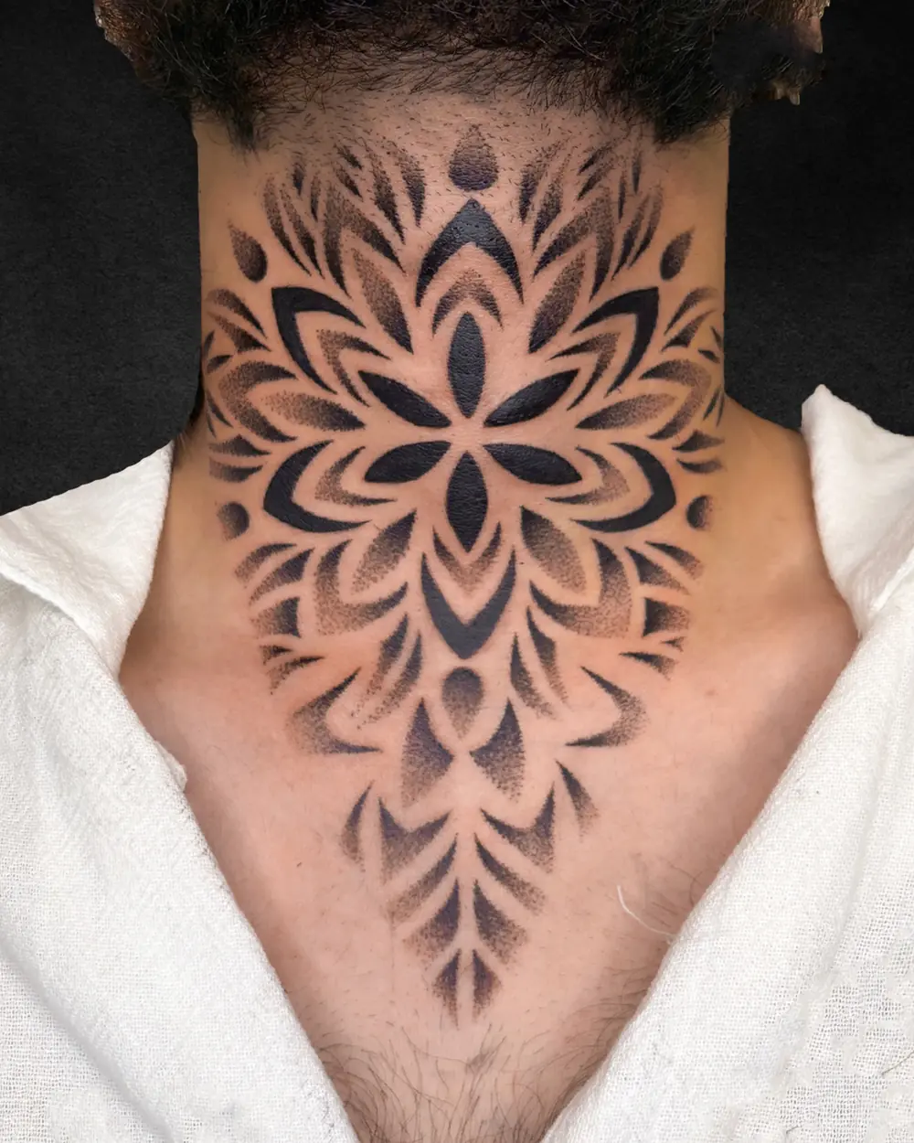 Mandala dotwork neck tattoo, ornamental black and grey throat piece at Rebel Tattoos Gurgaon